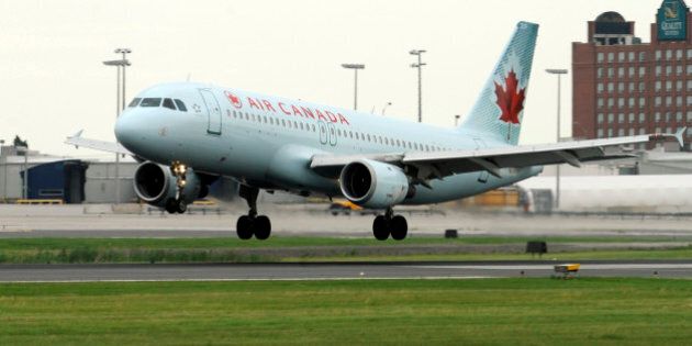 An Air Canada Airbus A320 - 200 lands on runway 24R at Pearson Airport this morning. TONY BOCK/TORONTO STAR (JUNE 19, 2010) (Photo by Tony Bock/Toronto Star via Getty Images)