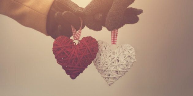Couple in love holding hearts.