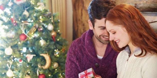 Couple exchanging gifts on Christmas