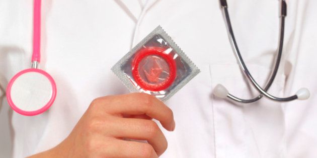 Doctor with condom