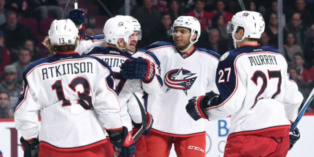 MONTREAL, QC - JANUARY 26: Brandon Dubinsky #17 of the Columbus Blue Jackets celebrates after scoring a goal against the Montreal Canadiens in the NHL game at the Bell Centre on January 26, 2016 in Montreal, Quebec, Canada. (Photo by Francois Lacasse/NHLI via Getty Images)
