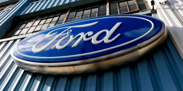 This Thursday, Nov. 19, 2015, photo, shows a blue oval Ford sign above the entrance to Butler County Ford in Butler, Pa. Ford announced Tuesday, Jan. 26, 2016, that the company is recalling nearly 391,000 Ranger pickups because the driver's air bag inflators can explode with too much force and cause injuries. The recall covers trucks from 2004 through 2006 in the U.S. and Canada. (AP Photo/Keith Srakocic)