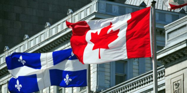 Montreal, Quebec, Canada: Canadian and Quebecer flags in front of the old Palace of Justice - Vieux palais de justice - Rue Notre Dame - Vieux-Montr?al - photo by M.Torres