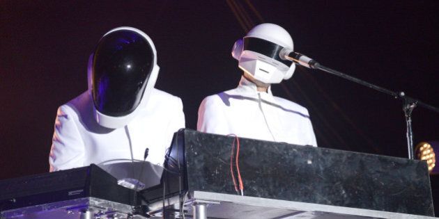 INDIO, CA - APRIL 20: Guests dressed as Daft Punk perform with Arcade Fire live onstage to close out the 2014 Coachella Valley Music And Arts Festival at The Empire Polo Club on April 20, 2014 in Indio, California. (Photo by C Flanigan/FilmMagic)