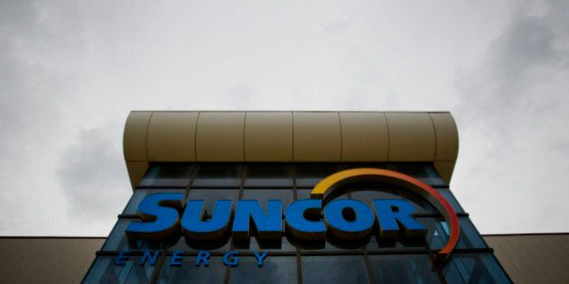 The Suncor Energy Inc. offices stand in Fort McMurray, Alberta, Canada, on Wednesday, June 19, 2014. Heavy crude from the oil sands has traded at an average of $18.70 per barrel below the U.S. benchmark over the last five years due to a transportation bottleneck in North America. The discount costs Canadas economy as much as C$50 million per day, according to the Canadian Chamber of Commerce. Photographer: Ben Nelms/Bloomberg via Getty Images