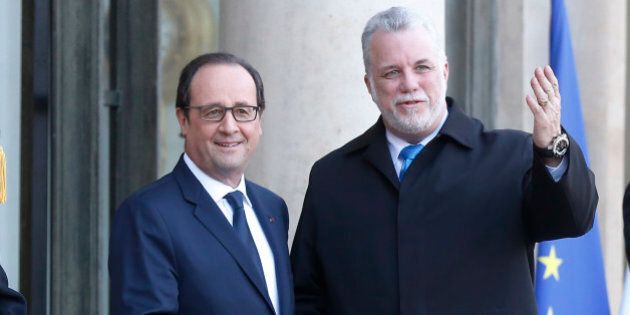 French President Francois Hollande, left, welcomes Quebec prime minister Philippe Couillard at the Elysee Palace in Paris, Monday, March 2, 2015. Philippe Couillard is on a five-day official visit in France. (AP Photo/Michel Euler)
