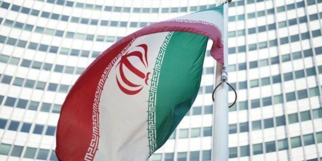 An Iranian flag waves in a wind outside the Vienna International Centre hosting the United Nations (UN) headquarters and the International Atomic Energy Agency (IAEA) as the socalled EU 5+1 talks with Iran take place in Vienna, on July 3, 2014. Negotiators from Iran and six world powers begin a marathon final round of talks towards a potentially historic agreement on Tehran's nuclear programme before a July 20 deadline.AFP PHOTO/JOE KLAMAR (Photo credit should read JOE KLAMAR/AFP/Getty Images)