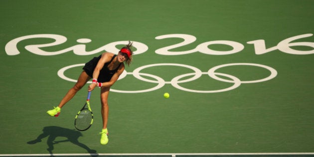 RIO DE JANEIRO, BRAZIL - AUGUST 08: Eugenie Bouchard of Canada serves during the Women's Singles second round match against Angelique Kerber of Germany on Day 3 of the Rio 2016 Olympic Games at the Olympic Tennis Centre on August 8, 2016 in Rio de Janeiro, Brazil. (Photo by Clive Brunskill/Getty Images)