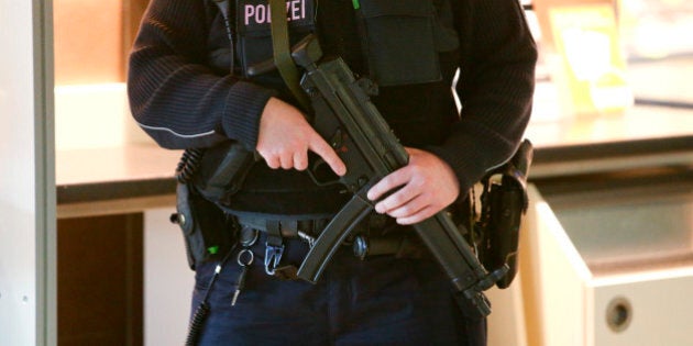 A German federal police officer guards with an Heckler & Koch MP5 submachine gun attends a drill at Ostbahnhof train station in Berlin, Germany April 4, 2016. REUTERS/Fabrizio Bensch