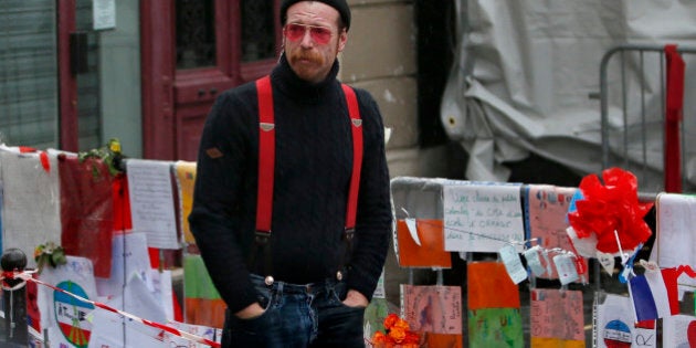 Jesse Hughes, member of Eagles of Death Metal band, mourns in front of the Bataclan concert hall to pay tribute to the shooting victims in Paris, France, December 8, 2015. The band Eagles of Death Metal, known as EODM, was performing at the Bataclan when the deadliest of the Islamic State attacks took place in Paris on November 13. REUTERS/Charles Platiau