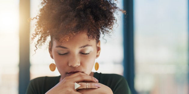 Shot of a young businesswoman sitting at her desk