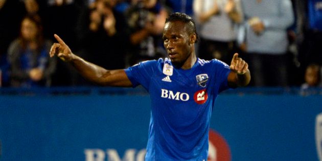 Sep 23, 2015; Montreal, Quebec, CAN; Montreal Impact forward Didier Drogba (11) reacts after scoring a goal against the Chicago Fire during the first half at Stade Saputo. Mandatory Credit: Eric Bolte-USA TODAY Sports