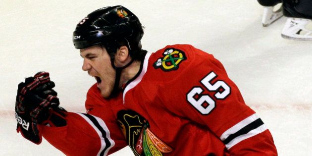 Chicago Blackhawks' Andrew Shaw celebrates after scoring a goal against the St. Louis Blues during the third period in Game 6 of a first-round NHL hockey playoff series in Chicago, Sunday, April 27, 2014. The Blackhawks won 5-1. (AP Photo/Nam Y. Huh)
