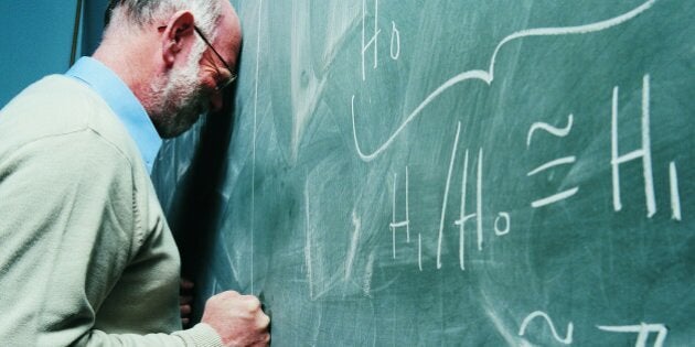 Portrait of a Frustrated Maths Lecturer Banging his Head Against a Blackboard