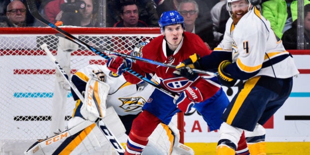 MONTREAL, QC - MARCH 02: Brendan Gallagher #11 of the Montreal Canadiens and Ryan Ellis #4 of the Nashville Predators battle for position near goaltender Pekka Rinne #35 during the NHL game at the Bell Centre on March 2, 2017 in Montreal, Quebec, Canada. (Photo by Minas Panagiotakis/Getty Images)