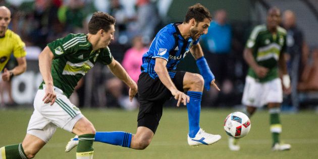 Jul 13, 2016; Portland, OR, USA; Montreal Impact midfielder Ignacio Piatti (10) takes a pass up the field against the Portland Timbers during the second half in a game at Providence Park. The game ended in a tie 1-1. Mandatory Credit: Troy Wayrynen-USA TODAY Sports