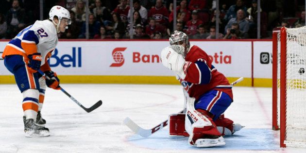Feb 23, 2017; Montreal, Quebec, CAN; New York Islanders forward Anders Lee (27) scores a goal against Montreal Canadiens goalie Carey Price (31) during the second period at the Bell Centre. Mandatory Credit: Eric Bolte-USA TODAY Sports