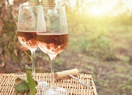 29018748 - two glasses of the rose wine in autumn vineyard. harvest time