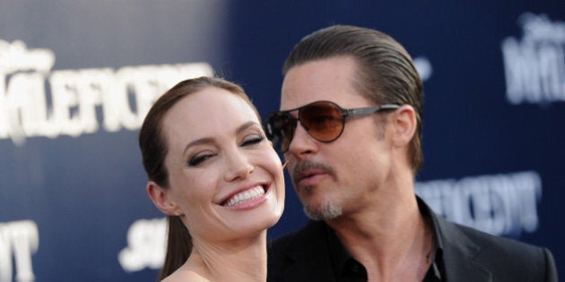 HOLLYWOOD, CA - MAY 28: Actors Angelina Jolie and Brad Pitt arrive at the World Premiere of Disney's 'Maleficent' at the El Capitan Theatre on May 28, 2014 in Hollywood, California. (Photo by Axelle/Bauer-Griffin/FilmMagic)