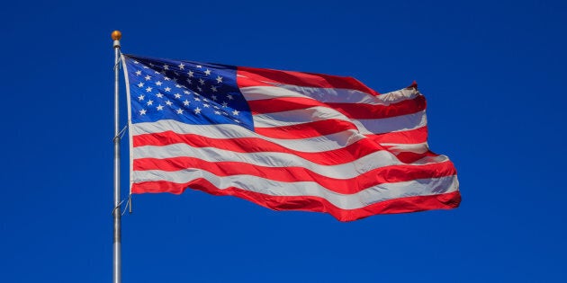 United States flag waving in clear sky