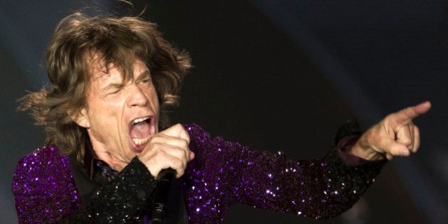 Rolling Stones singer Mick Jagger performs during a concert in Hayrkon Park in Tel Aviv, Israel, Wednesday, June 4, 2014. (AP Photo/Ariel Schalit)