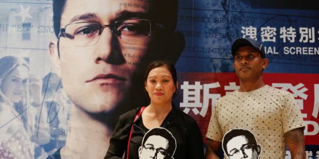 Asylum seekers Vanessa Mae Bondalian Rodel, 42, from the Philippines, and Ajith Pushpakumara, 44, from Sri Lanka, who helped hiding Edward Snowden while he was in Hong Kong in 2013, attend a special screening of the film