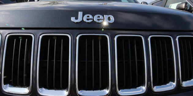 MIAMI, FL - APRIL 22: A 2015 Jeep Grand Cherokee vehicle is seen on a sales lot as Fiat Chrysler Automobiles announced that it is recalling more than 1.1 million cars and SUVs worldwide because the vehicles may roll away after drivers exit the vehicles on April 22, 2016 in Miami, Florida. The recall covers the 2012-2014 Dodge Charger and Chrysler 300 sedans and 2014-2015 Jeep Grand Cherokee sport utility vehicles. (Photo by Joe Raedle/Getty Images)