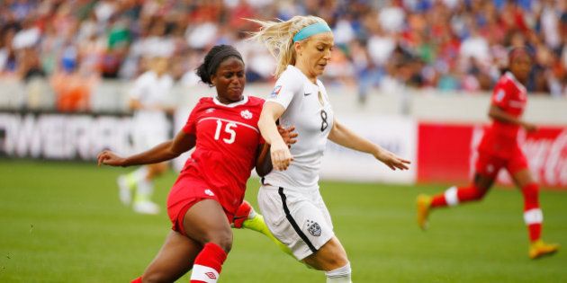 HOUSTON, TX - FEBRUARY 21: Julie Johnston #8 of the United States battles for the ball with Nichelle Prince #15 of Canada during the Championship final of the 2016 CONCACAF Women's Olympic Qualifying at BBVA Compass Stadium on February 21, 2016 in Houston, Texas. (Photo by Scott Halleran/Getty Images)