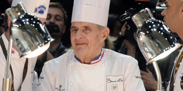 French Chef Paul Bocuse (C) and his son Jérôme (R) attend the 13th edition of the world final of the international culinary competition of the Bocuse d'Or (Golden Bocuse), on January 25, 2011 in Lyon, central eastern France. AFP PHOTO / PHILIPPE MERLE (Photo credit should read PHILIPPE MERLE/AFP/Getty Images)