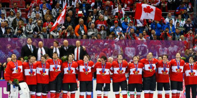 Canada's players sing their national anthem following the medal ceremony after their men's ice hockey gold medal victory over Sweden at the Sochi 2014 Winter Olympic Games February 23, 2014. REUTERS/Brian Snyder (RUSSIA - Tags: SPORT ICE HOCKEY OLYMPICS TPX IMAGES OF THE DAY)