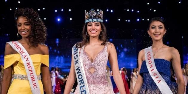 First runner up Miss Dominican Republic Yaritza Miguelina Reyes Ramirez (L); Miss World 2016 Stephanie Del Valle of Puerto Rico (C); and second runner up Miss Indonesia Natasha Mannuela (R) stand together after Del Valle's win in the Miss World 2016 pageant at the MGM National Harbor December 18, 2016 in Oxon Hill, Maryland. / AFP / ZACH GIBSON (Photo credit should read ZACH GIBSON/AFP/Getty Images)