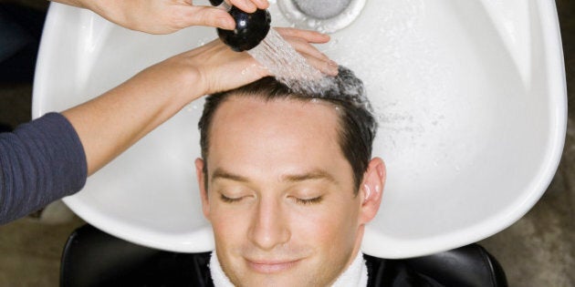 Man having hair washed at salon