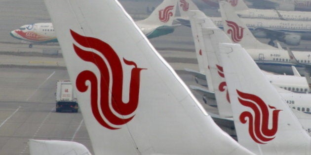 Flights of Air China are parked on the tarmac of Beijing Capital International Airport in Beijing, China, March 28, 2016. REUTERS/Kim Kyung-Hoon/File Photo