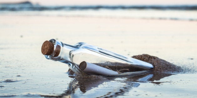 Message in a bottle on beach