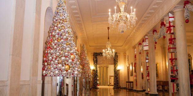 In the Grand Foyer of the White House, the theme is: "The Gift of Reflection", featuring stacked columns of shiny presents, mirrored ornaments adorning the trees and garlands, for the 2016 holiday decor at the White House in Washington, DC, on November 29, 2016. (Photo by Cheriss May/NurPhoto via Getty Images)