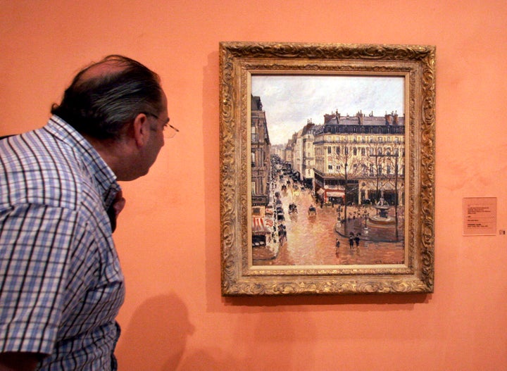 The impressionist painting "Rue St.-Honore, Apres-Midi, Effet de Pluie," on display in the Thyssen-Bornemisza Museum in Madri