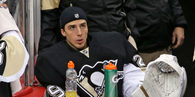 Pittsburgh Penguins goalie Marc-Andre Fleury sits on the bench during an NHL hockey game against the Buffalo Sabres in Pittsburgh, Tuesday, March 29, 2016. (AP Photo/Gene J. Puskar)