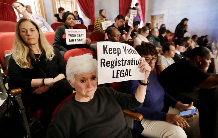 Voting rights activists say a new voter registration law is intended to make it harder to vote in reaction to a surge of vote