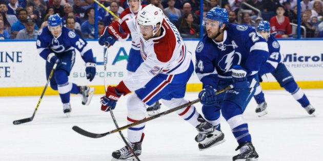 TAMPA, FL - MARCH 31: Ryan Callahan #24 of the Tampa Bay Lightning disrupts the shot of Stefan Matteau #21 of the Montreal Canadiens during the second period at the Amalie Arena on March 31, 2016 in Tampa, Florida. (Photo by Scott Audette/NHLI via Getty Images)