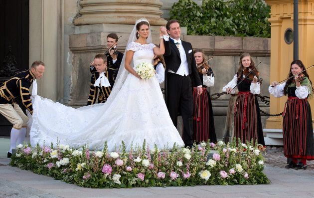 Princess Madeleine of Sweden and Christopher O'Neill greet the public after their wedding ceremony.