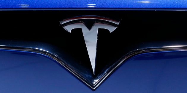 A logo is seen on the new Tesla Model X P90D at the 86th International Motor Show in Geneva, Switzerland, March 1, 2016. REUTERS/Denis Balibouse