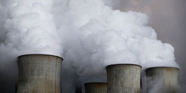 Steam rises from the cooling towers of the coal power plant of RWE, one of Europe's biggest electricity and gas companies in Niederaussem, Germany, March 3, 2016. REUTERS/Wolfgang Rattay/File Photo
