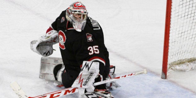 DENVER, CO - JANUARY 16: St. Cloud St. goaltender Charlie Lindgren #35 blocks a shot against Denver University during the second period at Magness Arena January 16, 2015. (Photo by Andy Cross/The Denver Post via Getty Images)