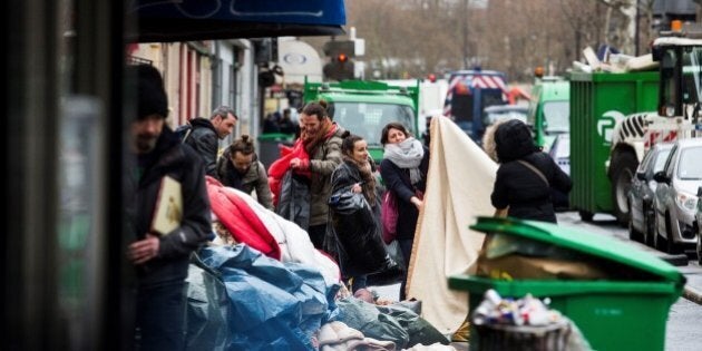 PARIS, FRANCE - MARCH 30: A group of people from associations supporting refugees are seen during during evacuation of the refugee camp under Stalingrad metro station in Paris, France on March 30, 2016. (Photo by Geoffroy Van der Hasselt/Anadolu Agency/Getty Images)