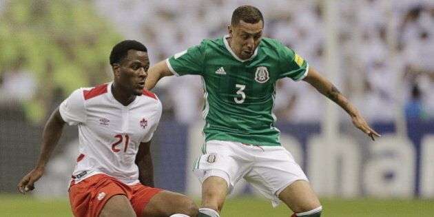 Football Soccer - Mexico v Canada - World Cup 2018 Qualifier - Azteca Stadium, Mexico City, Mexico - 29/3/16. Yasser Corona (3) of Mexico and Cyle Larin of Canada in action. REUTERS/Henry Romero