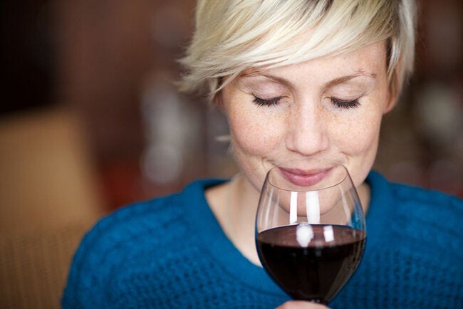 21258879 - closeup portrait of young female customer drinking red wine with eyes closed