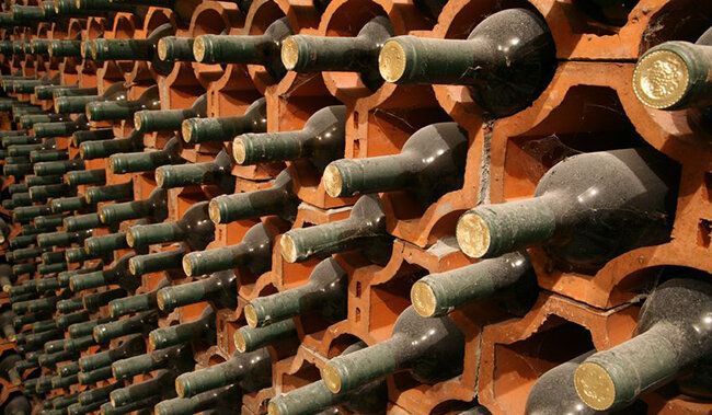 5695616 - racks with bottles in a dark wine cellar