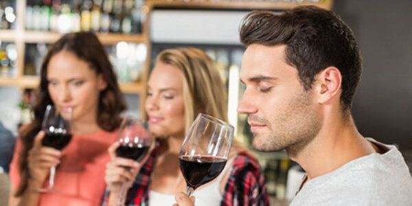 53794683 - friends smelling wine at bar
