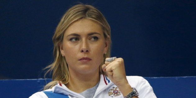 Russia's Maria Sharapova reacts as she watches compatriot Ekaterina Makarova play against Kiki Bertens of the Netherlands during their Fed Cup World Group tennis match in Moscow, February 6, 2016. REUTERS/Grigory Dukor
