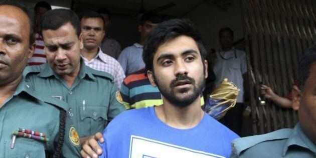 University of Toronto student Tahmid Hasib Khan (C) leaves after his court appearance in the Bangladesh capital Dhaka on August 13, 2016.Bangladeshi police have formally arrested a British national allegedly involved in the deadly Islamist attack on a Dhaka cafe that killed 22 people last month, officials said August 13. Hasnat Karim, a 47-year-old Briton, had initially been detained along with Tahmid Khan, 22, a University of Toronto student, as a suspect in the attack, which was claimed by the Islamic State group. / AFP / APF / REHMAN ASAD (Photo credit should read REHMAN ASAD/AFP/Getty Images)